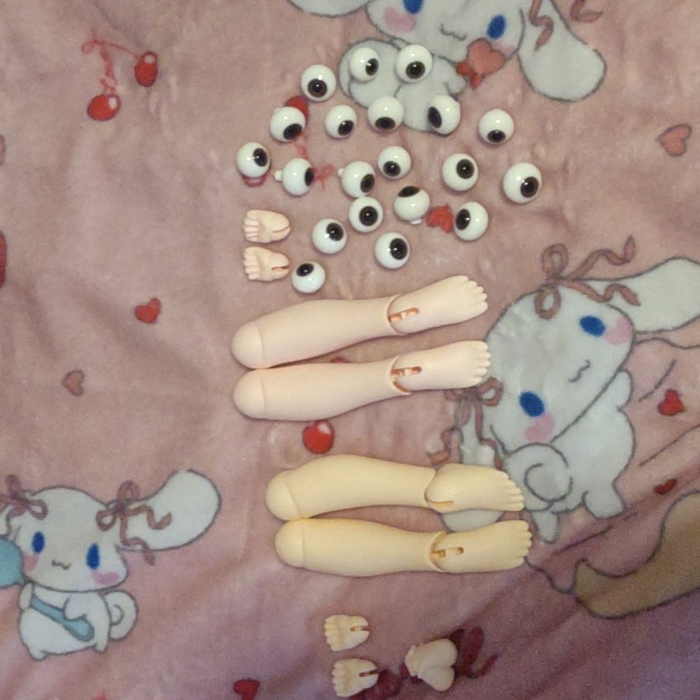 Puyoo kumako doll parts two legs with feet, hands, and eyes of different sizes